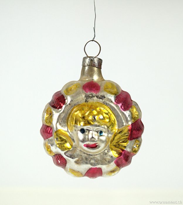 Ornament with Angel Head on both sides.