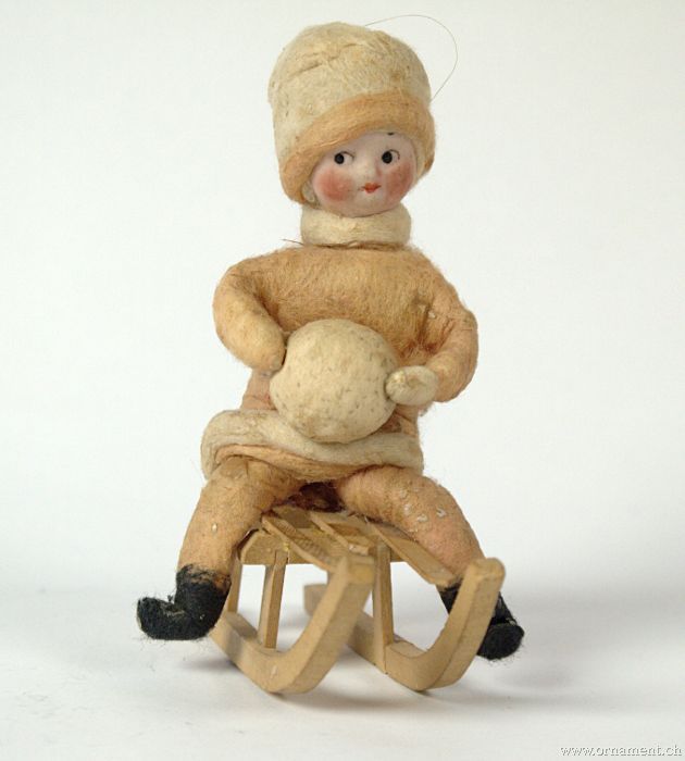 Heubach Googly-Eyed Girl on Sled with Snowball