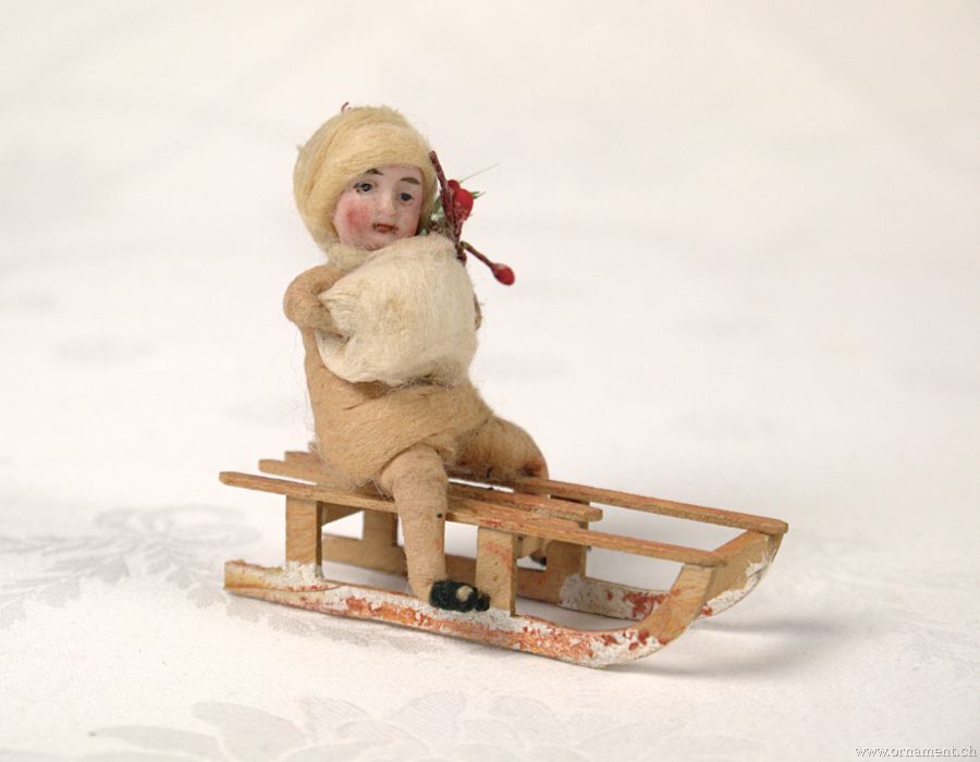 Heubach Googly-Eyed Girl on Sled with muff