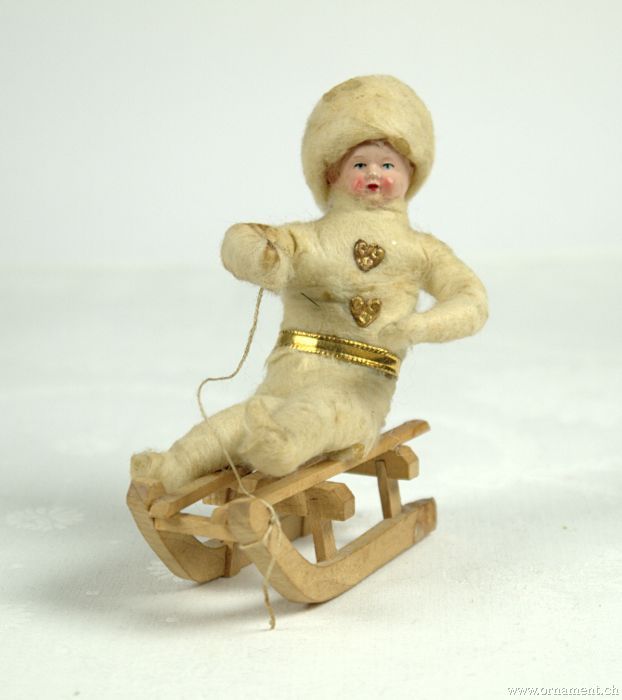 Cotton Boy with celluloid head on Sled