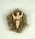 Tinsel Ornament with Wax Child